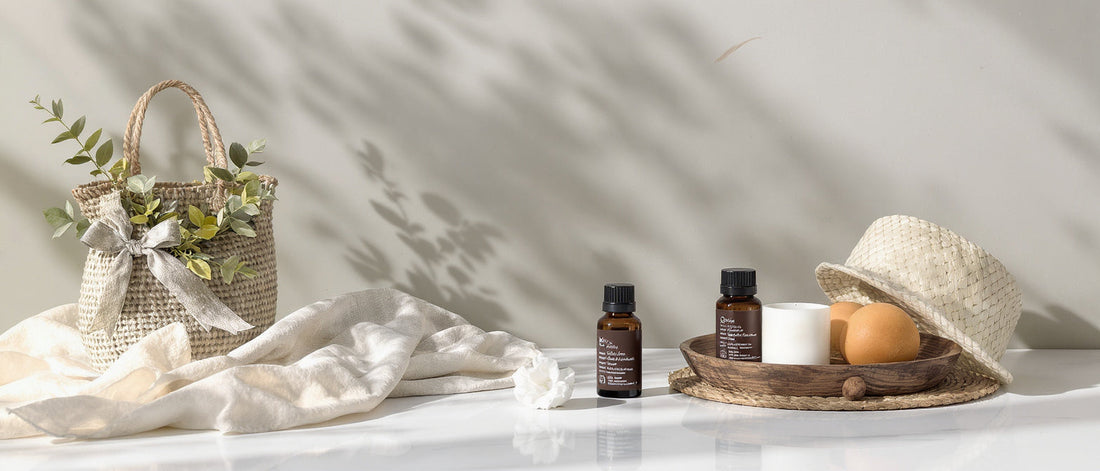 A close-up view of a vegan omega-3 softgel resting on a dark slate surface alongside raw flaxseeds, olive leaves, and sea buckthorn berries.