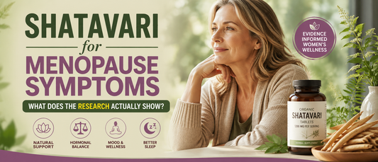 Woman in her early 50s holding a cup of herbal tea while learning about shatavari for menopause symptoms.